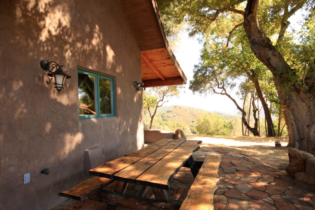 ANGEL DOG RANCH - Paso Robles, California- straw bale cabin overlooks Lake Nacimiento from atop an oak studded knoll