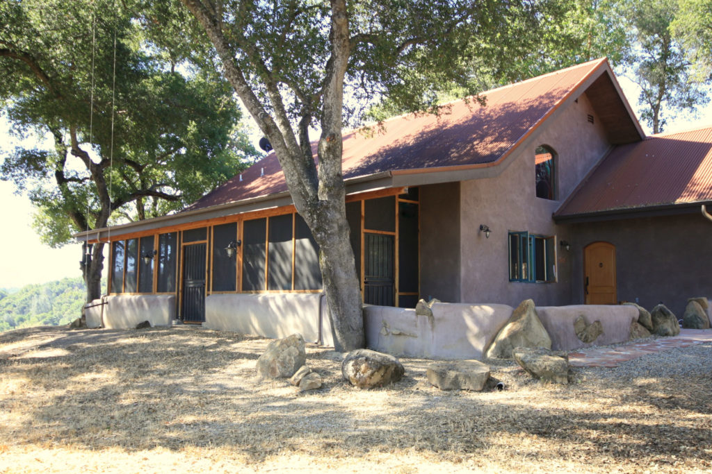 ANGEL DOG RANCH - Paso Robles, California- straw bale cabin overlooks Lake Nacimiento from atop an oak studded knoll